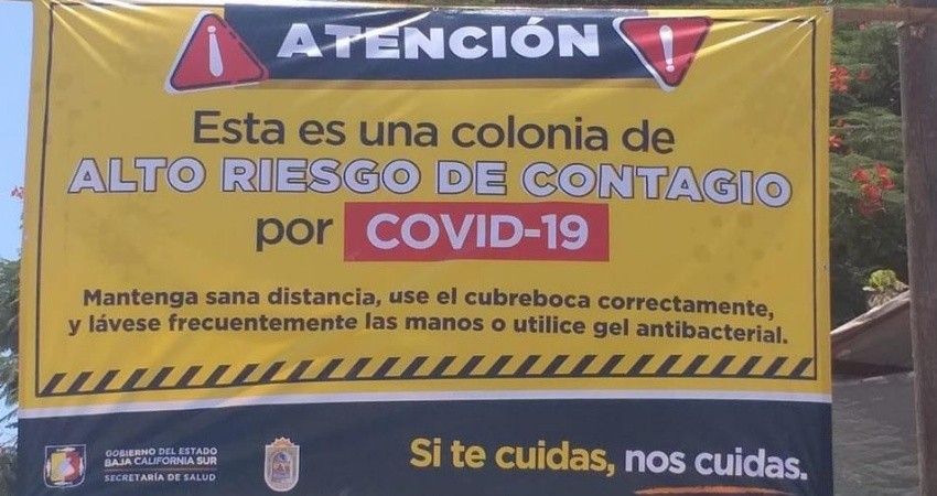 Colocan mantas de advertencia en colonias de BCS con altos niveles de contagio